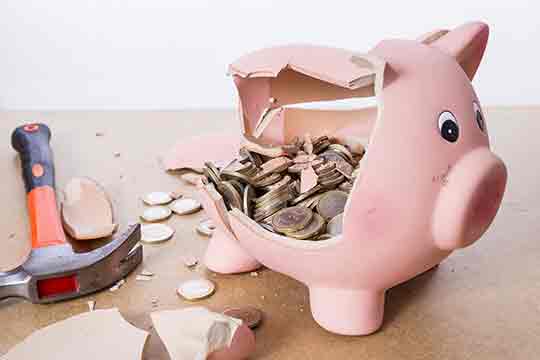 Broken piggy bank with hammer and money. Broken piggy bank with hammer and money.
