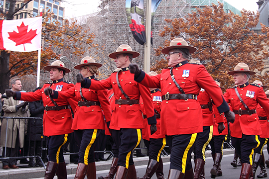 Members of the Royal Canadian Mounted Police marching. Members of the Royal Canadian Mounted Police marching.