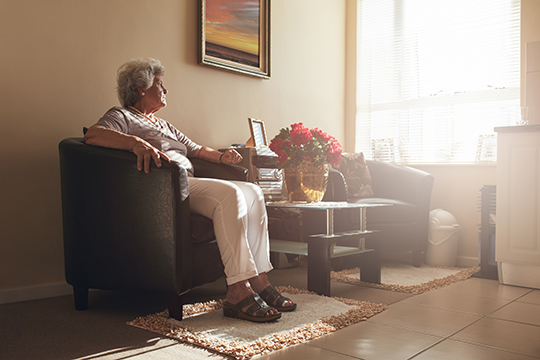 Senior woman sitting.