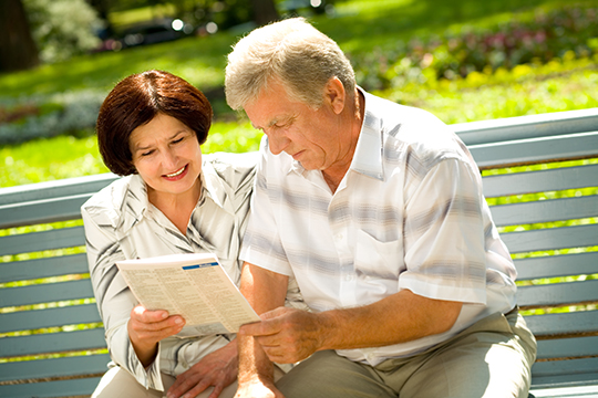 Senior couple reading.