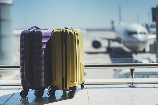 Two suitcases in an airport