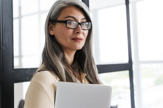 Adult woman with laptop computer.