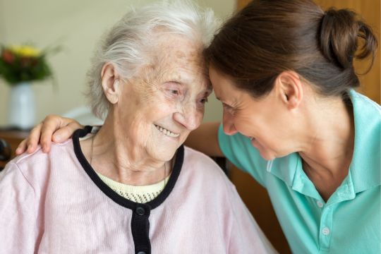 Long-term care resident with caregiver.