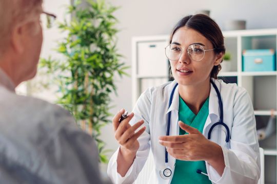 Doctor and adult patient in conversation.