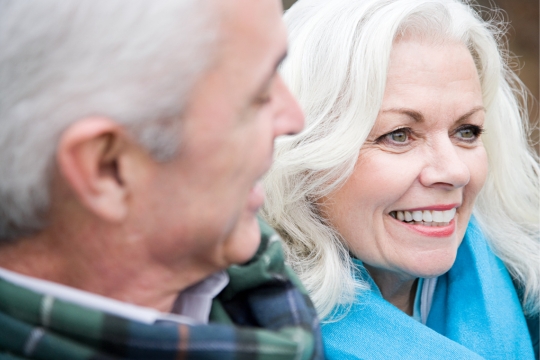 Smiling adult couple.