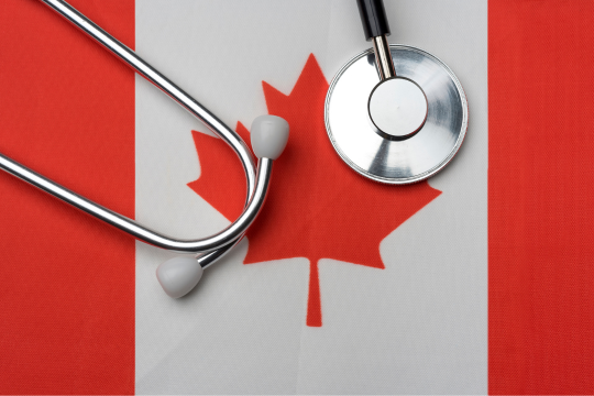 Stethoscope sitting on a Canadian flag Stethoscope sitting on a Canadian flag.