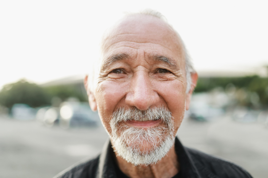 Older adult  facing the camera.