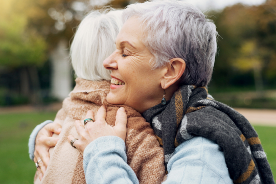 Two adult women friends outdoors. 