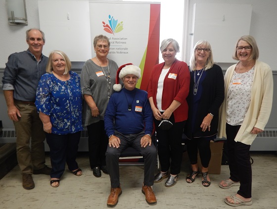 Early Christmas Picture of the Huronia Branch Board.  Sitting: Chris Auger, A/President - Standing Left to Right: Mark Burchell, Communications - Jackie Akeson, Director - Lynne Ellis, Past President - Kathy Rupnow, Recruitment - Dianne Michals, Secretary - Noreen Campbell, Treasurer - Leo Brooks, Advocacy (absent)