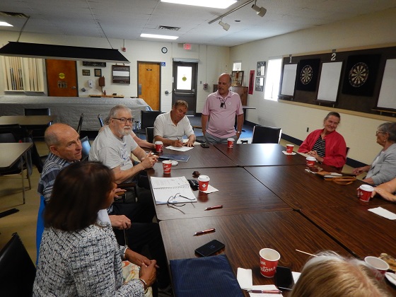 Starting at the bottom left with Pam, Ray, Bryan, John Ferguson, Chris Auger, President (standing), Lisa and Joan Gauthier