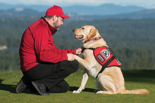 Stéphane Marcotte shown here with service dog, Sarge.