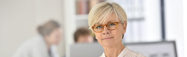 Lady standing in office.