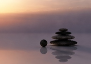 Stones stacked in low pond.