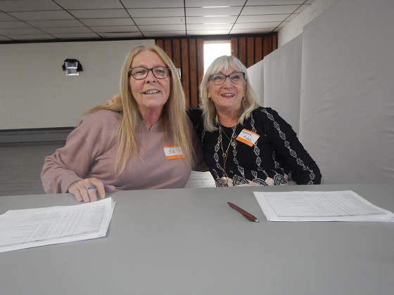 Dianne (left) and a volunteer at the registration desk