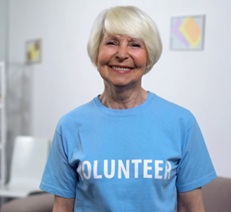 Woman wearing volunteer shirt.