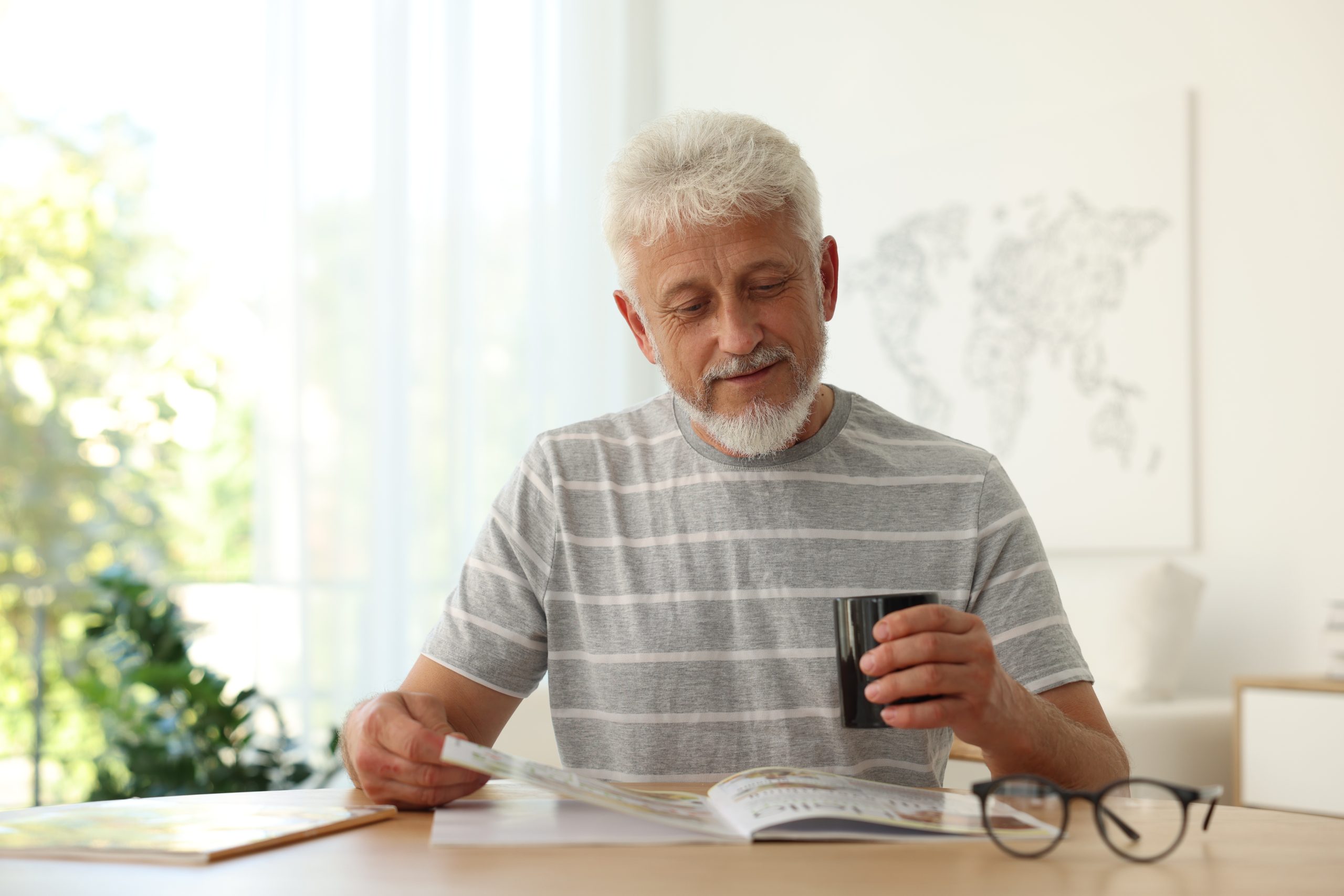 Man reading a magazine.