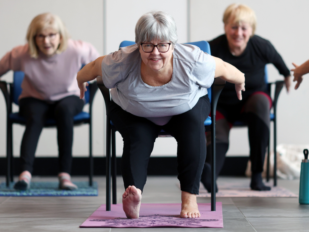 Ottawa resident and member Lisa Rudyk, centre, is seeing the benefits of chair yoga.