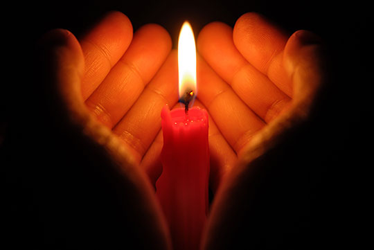 hand holding candle hand holding candle